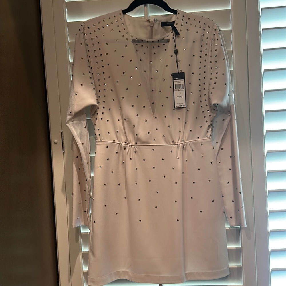 BCBG white party dress mini zipper on the back long sleeve. Never worn